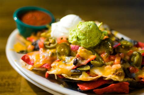 Buenos nachos. with beans, nacho cheese, onions, sour cream and tomato Small Nachos $2.40; Large Nachos $4.80; Small Nachos W/ Meat $3.00; Large Nachos W/beef. $5.60; Nachos W/chorizo Or Steak Small $3.60; Large $6.90; Guacamole W/chips … 