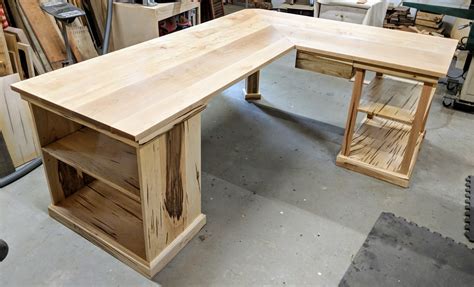 Build a desk. Trim out the frame of the DIY built in cabinet. Use a miter saw and cut the 1×3 to the length of your DIY built in computer desk. Then, install it to the front of the desk frame with wood glue and 1 1/4″ brad nails to trim it out. 6. Build the DIY wood desk top. 