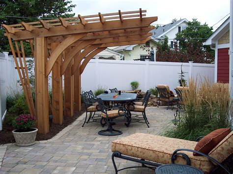 Build a pergola. Drawing in the 70’s interior trend of sunken conversation pits, this timber pergola design idea is perfect for adding a little luxury to a garden or backyard. 5. Pool and deck pergola. Jason Busch/Landart. Made from timber and wire this particular pergola design is perfect for climbing plants to grow on. 