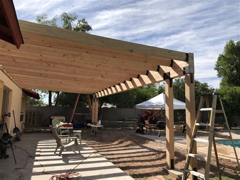 Building a patio cover. Plus, it's much easier to build a patio cover when it doesn't need to attach to your house. Advertisement - Continue Reading Below. 9 Patio Cover and Fireplace. Buff Strickland. 