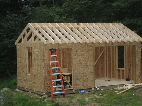 Building shed. 5. Front Panel Assembly. Layout the wall panels and raise the back panel. Position and secure one of the side panels and secure the second side panel. Raise the front panel and secure it, then square up the shed. Position roof panel and fix to shed walls. Temporary & Permanent Anchoring Instructions. 