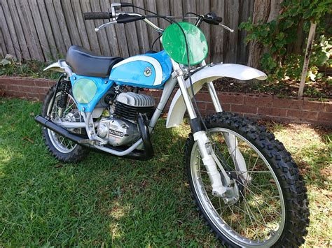 Bultaco motorcycles for sale. For sell a 1974 Bultaco Pursang M120 250cc restored . New parts are as follows new plastics , seat foam and cover , chain , sprockets , tires , tubes , liners , perches , levers , clutch cable and front brake cable , tank restored and sealed , rear spokes , frame painted , side panels restored , new grips . the motor runs great and shifts with no problems . 