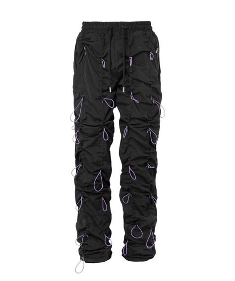 Bungee cord pants. Bungee cord pants are casual and sporty pants with adjustable cords that run along the sides. Learn how to customize the fit, choose the right look, and find the best fabric for … 