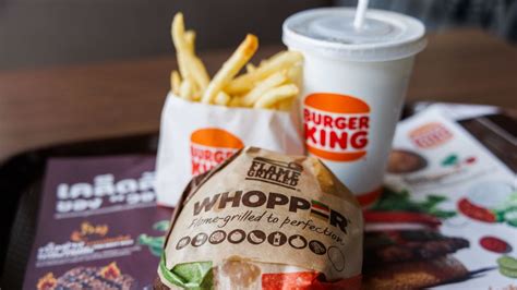 Our WHOPPER® Sandwich is a ¼ lb* of savory flame-grilled beef topped with juicy tomatoes, fresh cut lettuce, creamy mayonnaise, crunchy pickles, and sliced white onions on a soft sesame seed bun