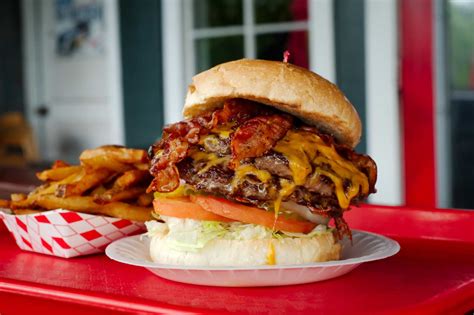 Burger places. Cheesy Jane’s serves up 100% ground chuck burgers in a retro diner atmosphere. Available in four sizes: one-third, one-half, three-quarter, and the big one-pounder. Burgers come with a variety ... 