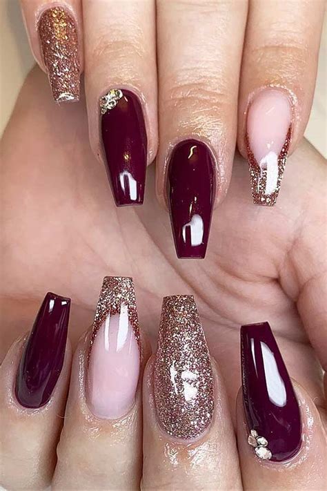 Burgundy nails with gold glitter. Get ready for some of the most exquisite brown and gold nail designs you have ever laid your eyes on. 1. Brown Marble Coffin Nails With Gold Foil. Source. Let’s begin with a touch of gold over light brown nails. A darker shade of brown is used to create a beautiful marble effect on the ring and middle fingers. 