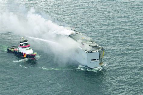 Burning cargo ship off Dutch coast will be towed to a new location after flames and smoke subsided