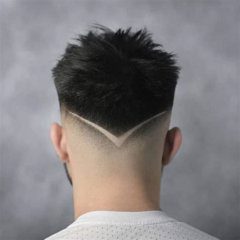 Featuring a long top divided with a side part and gradually faded sides with a mid (medium height) burst, this style looks sophisticated with a modern twist. 4. Brushed-Over Burst Cut. MDV Edwards/Shutterstock. Burst fading adds a punchy edge to this otherwise basic taper fade haircut.. Burst fade freestyle design