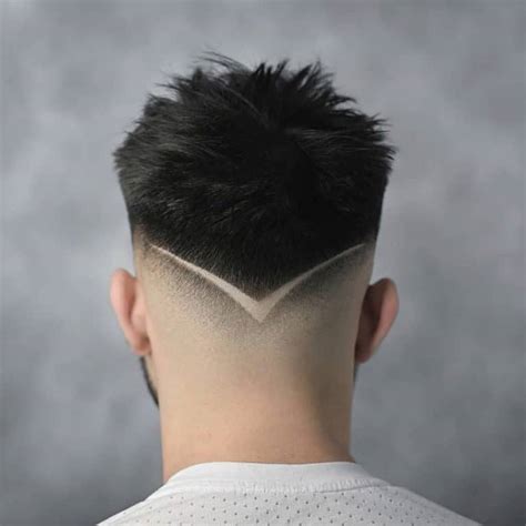 Burst fade haircut back view. 32. Skin Fade with Caeser Taper Cut. Skin Fade with Caesar Taper Cut would be a hairstyle where the hair is cut close to the skin on the sides and back, fading into longer hair on top. The hair on top would have a horizontal fringe across the forehead and gradually get longer towards the back, similar to a taper cut. 