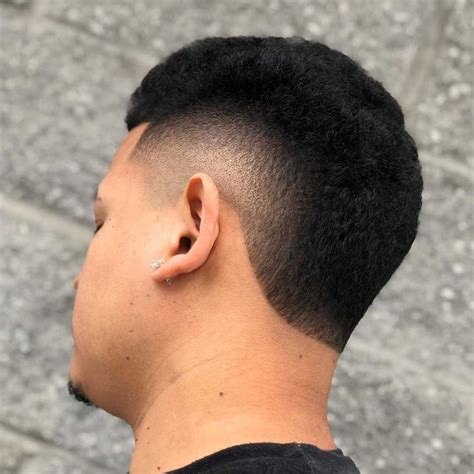 French Crop and Designer Burst Fade. Here you can really see the Caesar's influence on the style. The evenly textured top flows forward and drops down in a mini fringe onto the top of the forehead. The burst fade is small but clean, and the temple edges are left longer to form a unique take on sideburns. 20 / 32.. 