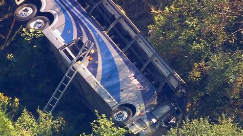 Bus carrying high school students to band camp crashes, killing 1 person and hurting dozens