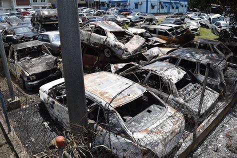 Bush fire near Cunupia police station destroys 13 cars