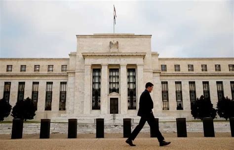 Business Highlights: Fed chair hints at rate hike pause; Talks to avoid US default at standstill
