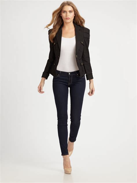 Business casual dress for women. For a business casual work dress look with the perfect mix of polish and femininity, style a flowy flare dress with a sleek and stylish women’s blazer. For your after-work plans, transition your work dress look by switching to a casual cardigan and a pair of fashionable sneakers or simple flats for relaxed ease. 