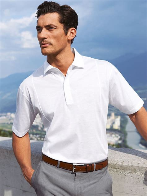 Business casual polo. An upscale casual dress code for men is generally considered an outfit that is nicer and a little more formal than typical business casual attire. Examples of an upscale casual war... 