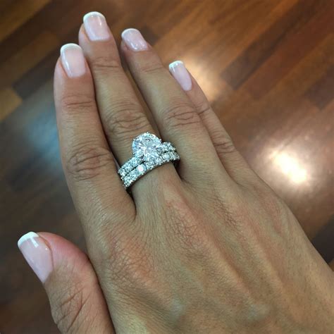 Buy engagement ring. Buy on Saks Fifth Avenue $95. Crafted with a gorgeous, high-quality cubic zirconia stone at the center and a series of smaller accent stones surrounding the band, this engagement ring is a dainty ... 