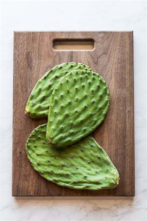 Cactus paddles recipe. In a salad bowl, whisk together the lime juice, olive oil, remaining salt and pepper and cumin. Add the minced chiles and garlic. Allow to rest while grilling the cactus. Transfer cactus paddles to the hot grill. Cook each side for 4 minutes or until grill marks are visible. 