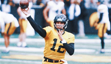 Cade McNamara throws for two touchdowns in his debut as No. 25 Iowa defeats Utah State 24-14