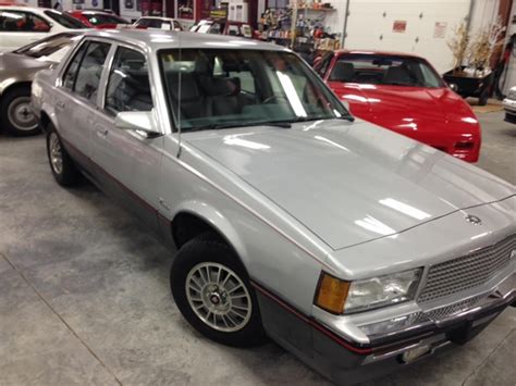 Prices shown are the prices you can expect to pay for a 1984 Cadillac Cimarron 4 Door Sedan across different levels of condition. Edit options. Base Price $12,614. Options $0. Original MSRP $12,614. Base Price $650. Options $0. ... Average Retail $1,175. Base Price $1,425. Options $0. High Retail $1,425. 1984 Cadillac Cimarron for Sale near .... 