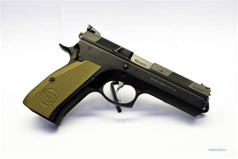 As mentioned, the front sight dovetail of CZ 75 pistols and many clones is longitudinal, meaning it runs front-to-back instead of side-to-side, with the front sight getting sandwiched between the slide and the barrel bushing. Some sights come pre-milled with a roll pin slot and others do not. In the former case, you have to install the sight ....