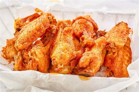 Cajun wings wingstop. With machine on, slowly pour in oil and process until a thick paste forms. In a large bowl, combine wings and paste. Toss until wings are well coated. Cover and refrigerate over night. Broil or grill wings until nicely browned outside and cooked through. Serve warm or at room temperature. 