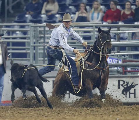 Caleb Smidt ropes a calf in the tie-down competition during the Supe