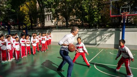 California Gov. Gavin Newsom plows into child while playing basketball in China 