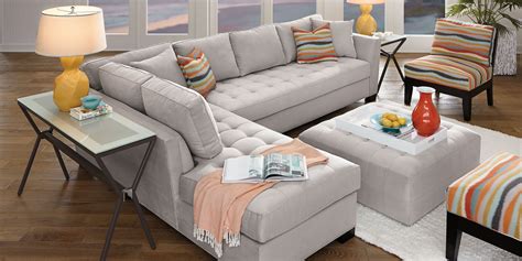 Calvin Heights 2 Pc Left Arm Chaise Sectional. Stylish and highly versatile, the Calvin Heights sectional offers a classy, contemporary feel that is both elegant and inviting. Covered in thickly textured woven fabric that offers comfortable, deep seating for you and your guests, the stylish smoke gray color lends fantastic eye appeal.. 