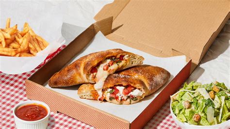 Calzone 900 cal. Mozzarella cheese wrapped with butter-brushed dough, sprinkled with parmesan & oregano, then baked to perfection. Served with a side of marinara sauce. +1 for each ingredient. Create your own Calzone with the delicious ingredients from our Pizza Ingredient List.. 