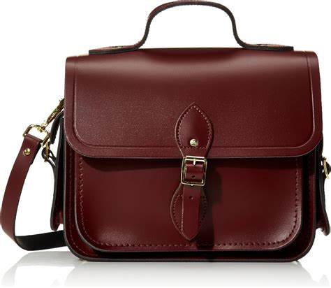 Cambridge satchel company. Quickview. The 11 Inch Batchel. Oxblood. + 2 colours. €275.00. Quickview. Discover our leather satchels for Women, handcrafted in England by our skilled makers, this shoulder bag is ideal for women! 