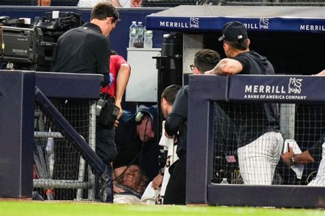 Cameraman at MLB game struck by wild throw, carted off on stretcher