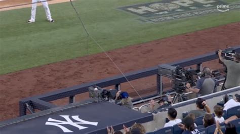 Cameraman injured by errant throw as Orioles topple Yankees in sloppy defeat