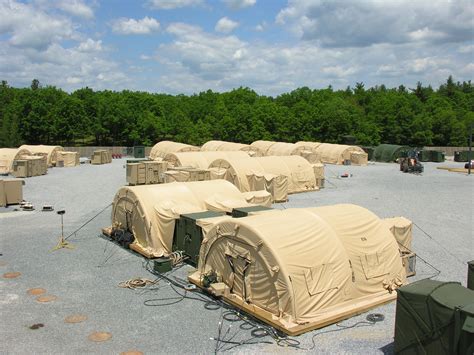 Military camp definition: A camp is a collection of huts and other buildings that is provided for a particular... | Meaning, pronunciation, translations and examples in American English. 