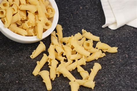 Campenelle. Campanelle is a type of pasta with a bell-like shape and a hollow center. It is made with non-GMO ingredients and can be paired with various sauces, such as cheese, vegetables, meat, or tomato. 