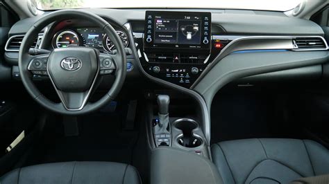 Camry interior. The interior lights may turn on automatically when. If any of the SRS airbags deploy (inflate) or in the event of a strong rear impact, the interior lights will turn on automatically. The interior lights will turn off automatically after approximately 20 minutes. The interior lights can be turned off manually. 