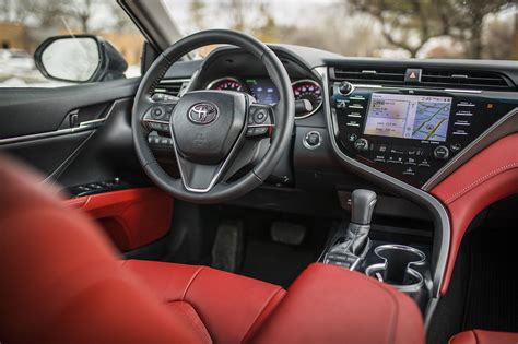 Camry red interior. This Toyota has seating for up to five people in two rows. Cloth upholstery is standard, and 60/40-split-folding rear seats are standard in the LE, SE, XLE, and … 