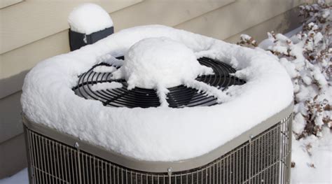 Can you pour hot water on a frozen heat pump?