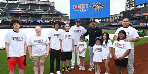 Cancer survivors Liam Hendriks and Carlos Carrasco team up to host pediatric patients at Citi Field