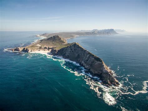 Cape of good hope south africa. The Cape of Good Hope is a scenic wonder, where soft white sandy beaches alternate with rugged stretches of rock and breathtaking cliffs. The cliffs at Cape Point are among the highest coastal cliffs in the world. The mingling of the icy Atlantic Ocean with the warmer Indian Ocean results in a unique coastal environment and one of the most ... 