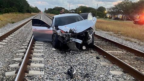 Car hits train after chase; driver dies