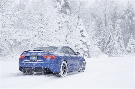 Car in snow. Both AWD and FWD-equipped cars can stay afloat in winter, albeit in varying conditions. But the formula is incomplete without winter tires. You see, all-season tires are okay-ish in winters, but those are not the most efficient ones. Slapping on winter tires brings about a drastic change in handling and traction. 