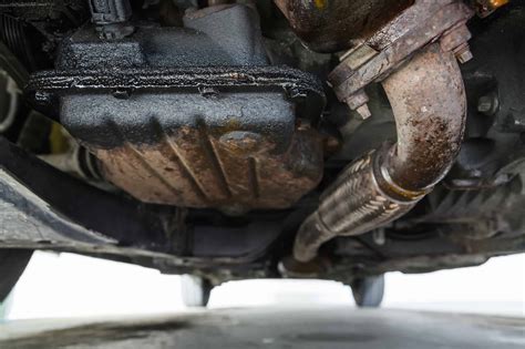 Car is leaking oil. 5 Ways to Prevent Oil Leaks · Loose oil filters. · Damaged oil pans. Your oil pan cleans, lubricates, and cools your engine. · Worn drain plug or valve cover&n... 