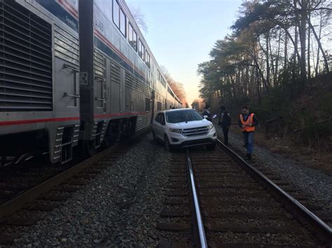 Car struck by Amtrak train after crossing railroad tracks on North Side: CFD