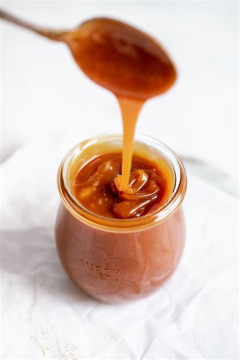 Caramel. Nov 10, 2023 · How to Make Caramels. 1. Lightly grease a 9×13-inch pan with butter and line it with parchment paper. Allow the excess parchment paper to come up the sides of the pan. Lightly butter the parchment paper as well. 2. Combine white sugar, light brown sugar, light corn syrup, butter, and salt in a heavy-bottomed saucepan. 