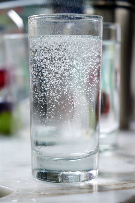 Carbonated water soda. Baking soda does not chemically soften water, but it makes the water slicker and feel softer to the skin. Baking soda is also known as sodium bicarbonate. Washing soda, sodium carb... 