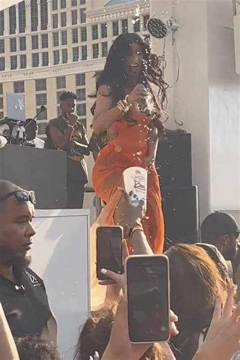Cardi B throws mic at concertgoer after drink is tossed at her