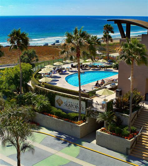 Carlsbad seapointe resort. Carlsbad Seapointe Resort is ideally perched atop a seaside bluff overlooking the Pacific Ocean and Coastal Highway 101. After a day of sightseeing or enjoying the beach, unwind to the relaxing sound of the ocean amid stylish décor and comfortable amenities. The family-friendly resort is just minutes away from LEGOLAND® California Resort ... 
