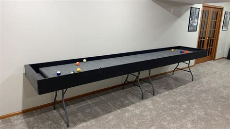 Carpet ball table. Ships fully assembled except for attaching the legs. Carpetball table ship weight: 16' model approx. 625lbs. 12' model approx. 550 lbs. Dimensions: 12ft - 144"L x 25"W x 30"H / 16ft - 192"L x 25"W x 30"H. Custom laminates offered. Please call Customer service to discuss. Carpetball Table - Commercial Grade - Black - This great Carpetball Table ... 