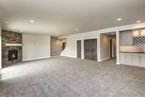Carpet for basement. One drawback that some people notice is an unpleasant odor, but this usually dissipates over time. 5. Vinyl planks or tiles. ($2-$7/sq. ft.): This basement flooring option offers great value for the money. Vinyl tile and vinyl plank flooring are easy to install, thanks to interlocking joints. 