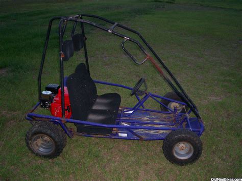 Full suspension go-kart; Electric start; 19in knobby tires; 2 seat - adjustable with 37in to 41in. seat to pedal distance; Automatic transmission with reverse gear; 4-wheel hydraulic disc brakes; Utility rack; Dual headlights; Rack and pinion steering; Swing-arm rear suspension; 4-point seat belts; All wheel fenders; Parking brake with brake .... 